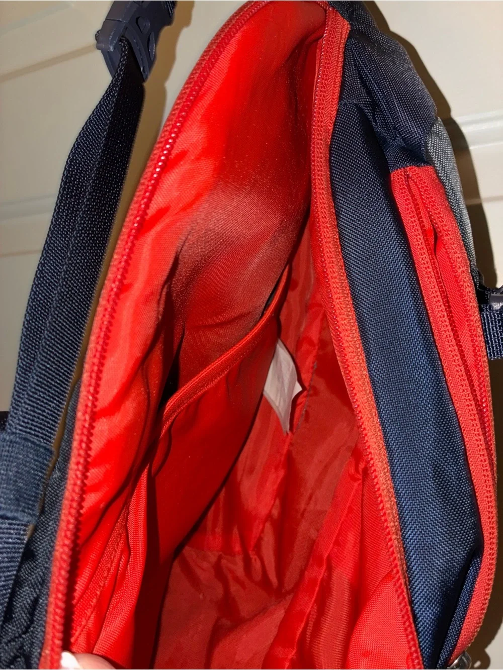 Patagonia Atom Sling 8L crossbody pack in a navy blue